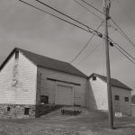 Two Barns and a Telephone Pole